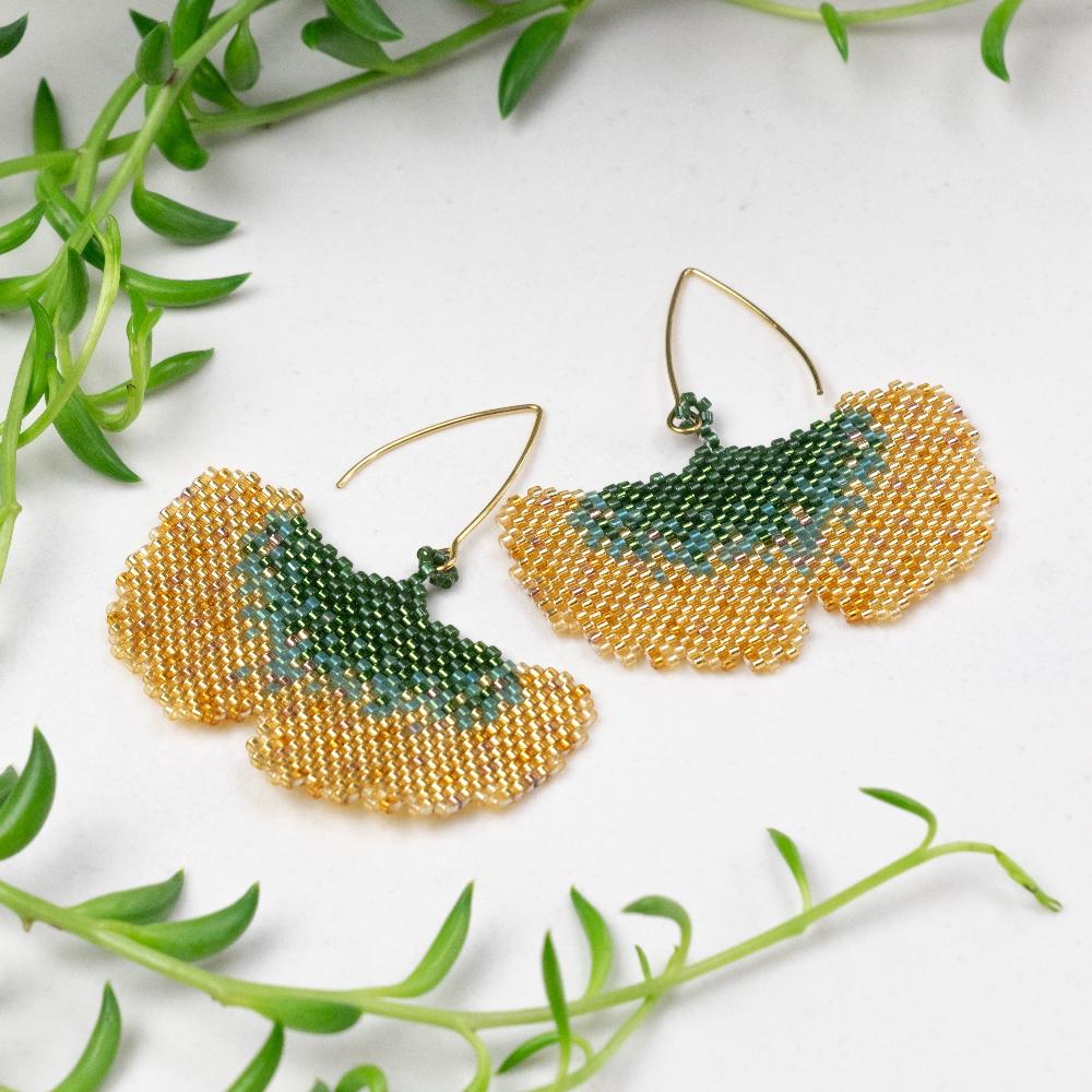 Golden fall Ginkgo Leaf earrings of glass beads.