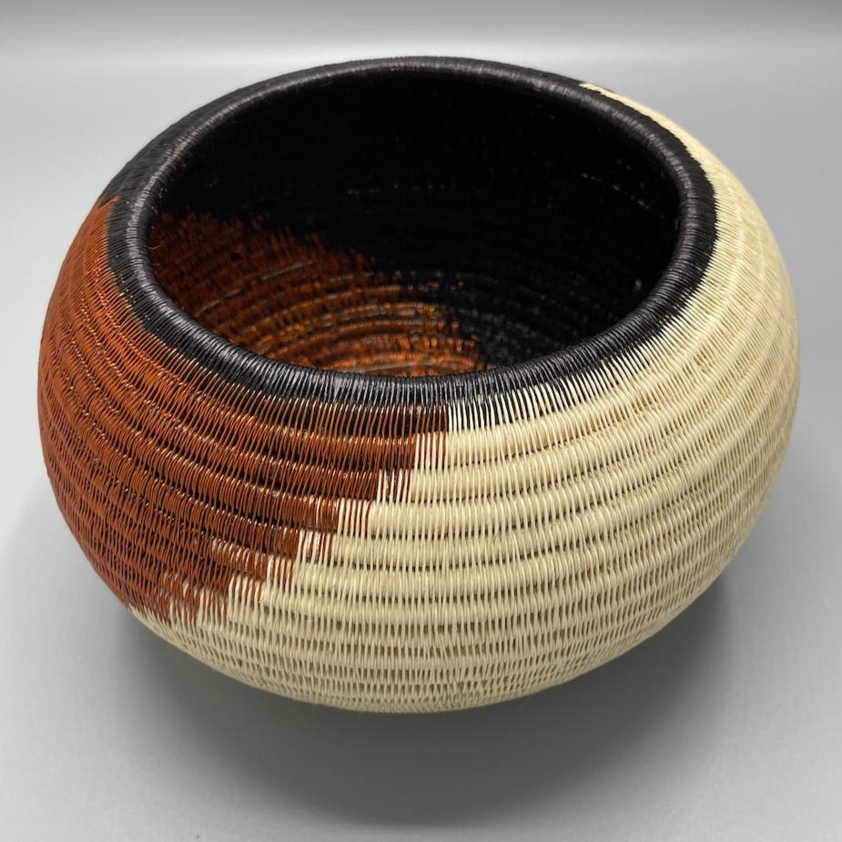 Woven werregue vase bowl handmade in Colombia. Chunga palm leaf and copper thread wire.  